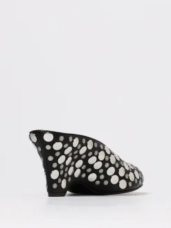 Mules con zeppa Khaite in pelle con borchie