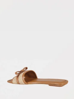 Mules Stuart Weitzman in rafia e pelle con fiocco